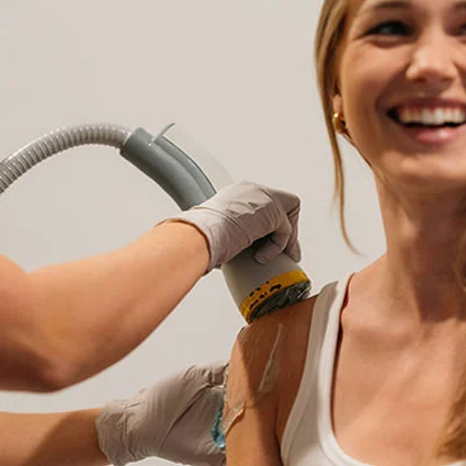 Patient receiving SoftWave shockwave therapy to the shoulder for rotator cuff pain