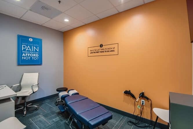Treatment room with orange accent wall