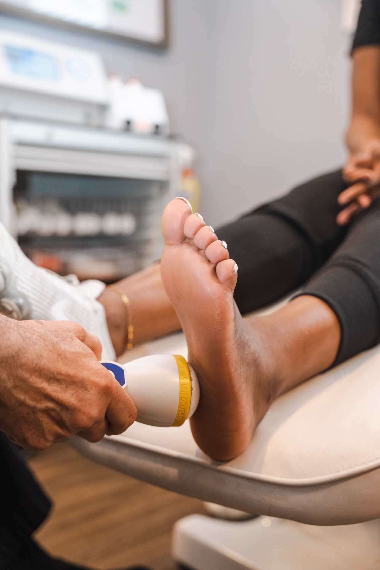 Close-up of a bare foot with the heel highlighted suggesting plantar fasciitis pain