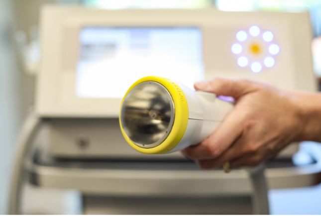 SoftWave applicator used during a treatment session