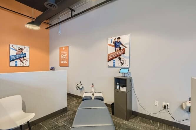 Treatment booth with orange accent wall